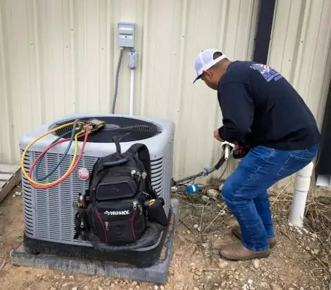 An Artic Air technician diagnoses the problem with this customer's air conditioner.